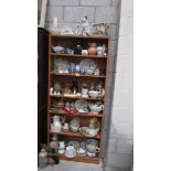 Seven shelves of interesting china.