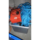 A battery charger and a quantity of rope.