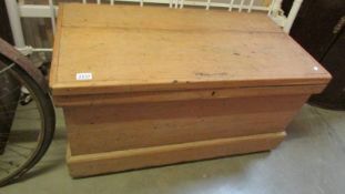 A pine blanket box.