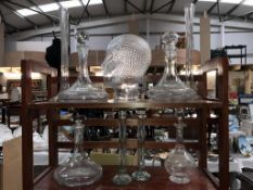 4 glass decanters, a glass head,