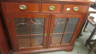 A good quality modern mahogany astragal glazed cabinet.