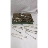 25 pairs of EPNS sugar tongs.