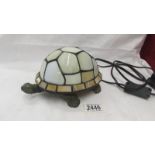 A Tiffany style "Tortoise" shaped table lamp.