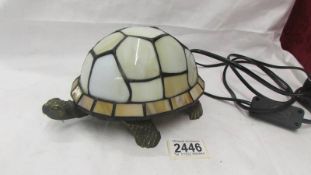 A Tiffany style "Tortoise" shaped table lamp.