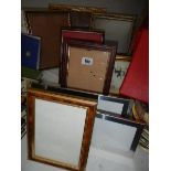 A quantity of picture frames.