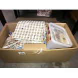 A box of kiloware stamps including unsorted & sheets