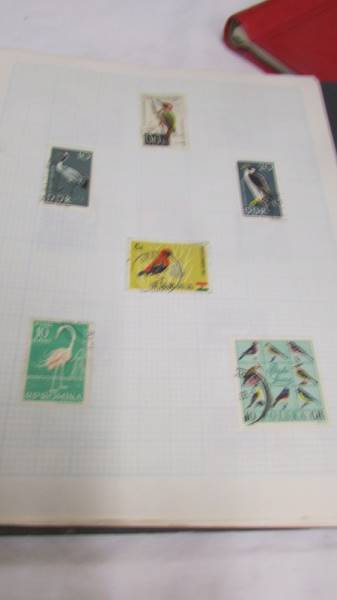 Four folders of assorted world stamps. - Image 11 of 19