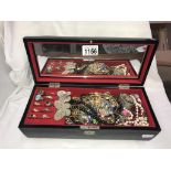 A musical jewellery box containing costume jewellery