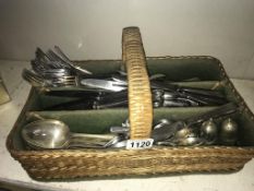 A wicker cutlery tray & selection of flat ware