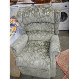 A reclining arm chair in good condition.