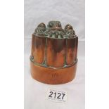 A Victorian copper jelly mould.