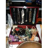 A mixed lot of costume jewellery in box.