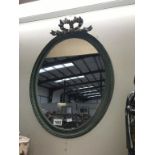 A shabby chic oval mirror