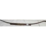 A good antique bow with fitted arrow holder to front,