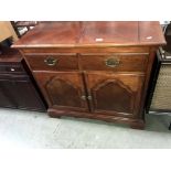 A dark wood stained 2 drawer cupboard with folding top, 96 x 48 x 87 cm high.