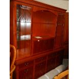 A mahogany unit with cut glass doors.