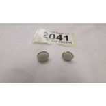 A pair of 9ct gold earrings set natural opals.