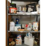 Three shelves of boxed items.