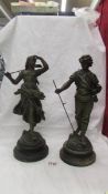 A pair of spelter figures, 38 cm tall.