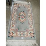 An oblong Chinese rug,