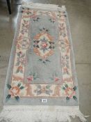 An oblong Chinese rug,