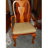 A Queen Anne style elbow chair.