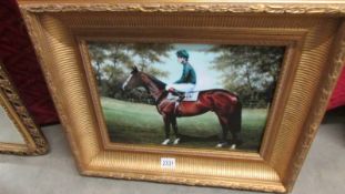 A print of a racehorse with jockey in a superb quality gilt frame.