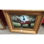 A print of a racehorse with jockey in a superb quality gilt frame.