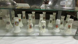 Eighteen crested china hat pin vases, various locations.