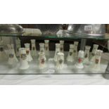 Eighteen crested china hat pin vases, various locations.