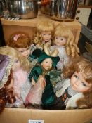 A box of porcelain collector's dolls.