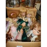 A box of porcelain collector's dolls.