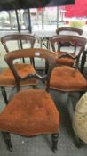 A set of four mahogany dining chairs.