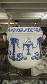 A 19th century blue and white slop bucket with lid.