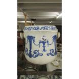 A 19th century blue and white slop bucket with lid.