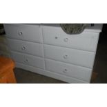A white 6 drawer bedroom chest.