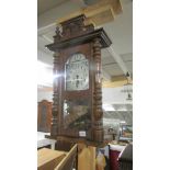 A mahogany wall clock.