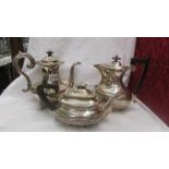 Two silver plate coffee pots and a silver plate teapot.