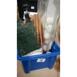 A box of table tennis items including net, balls, bats etc.