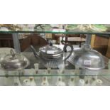 A silver plate teapot, meat cover and tureen lid.