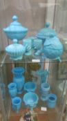 A mixed lot of blue glass including lidded bowls, vases, pots etc., 15 items in total (2 shelves).