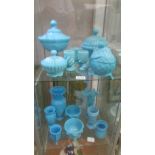 A mixed lot of blue glass including lidded bowls, vases, pots etc., 15 items in total (2 shelves).
