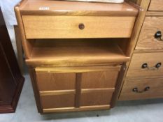 A 1970's teak bedside unit with cupboard & drawer