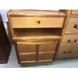 A 1970's teak bedside unit with cupboard & drawer