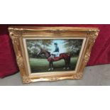 A print of a racehorse with jockey in a superb quality gilt frame.