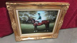 A print of a racehorse with jockey in a superb quality gilt frame.