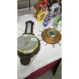 An oak barometer/thermometer in good condition together with another barometer (cracked glass)