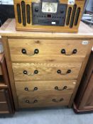 A modern solid oak bedroom chest of drawers