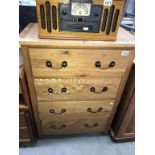 A modern solid oak bedroom chest of drawers