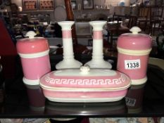 2 pink lidded jars,